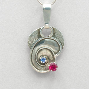 Jim Kelly Tanzanite and Lab Ruby Swirl Silver Pendant